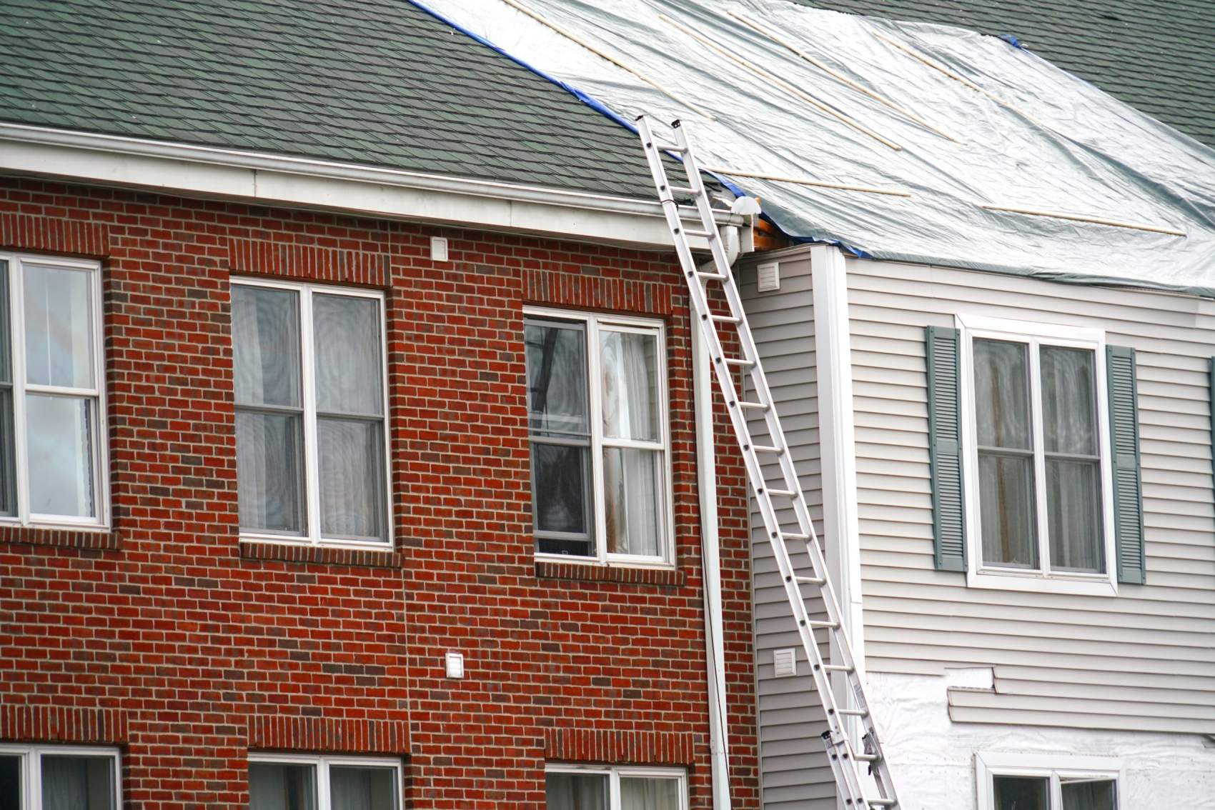 Apartment building roof repair, construction site